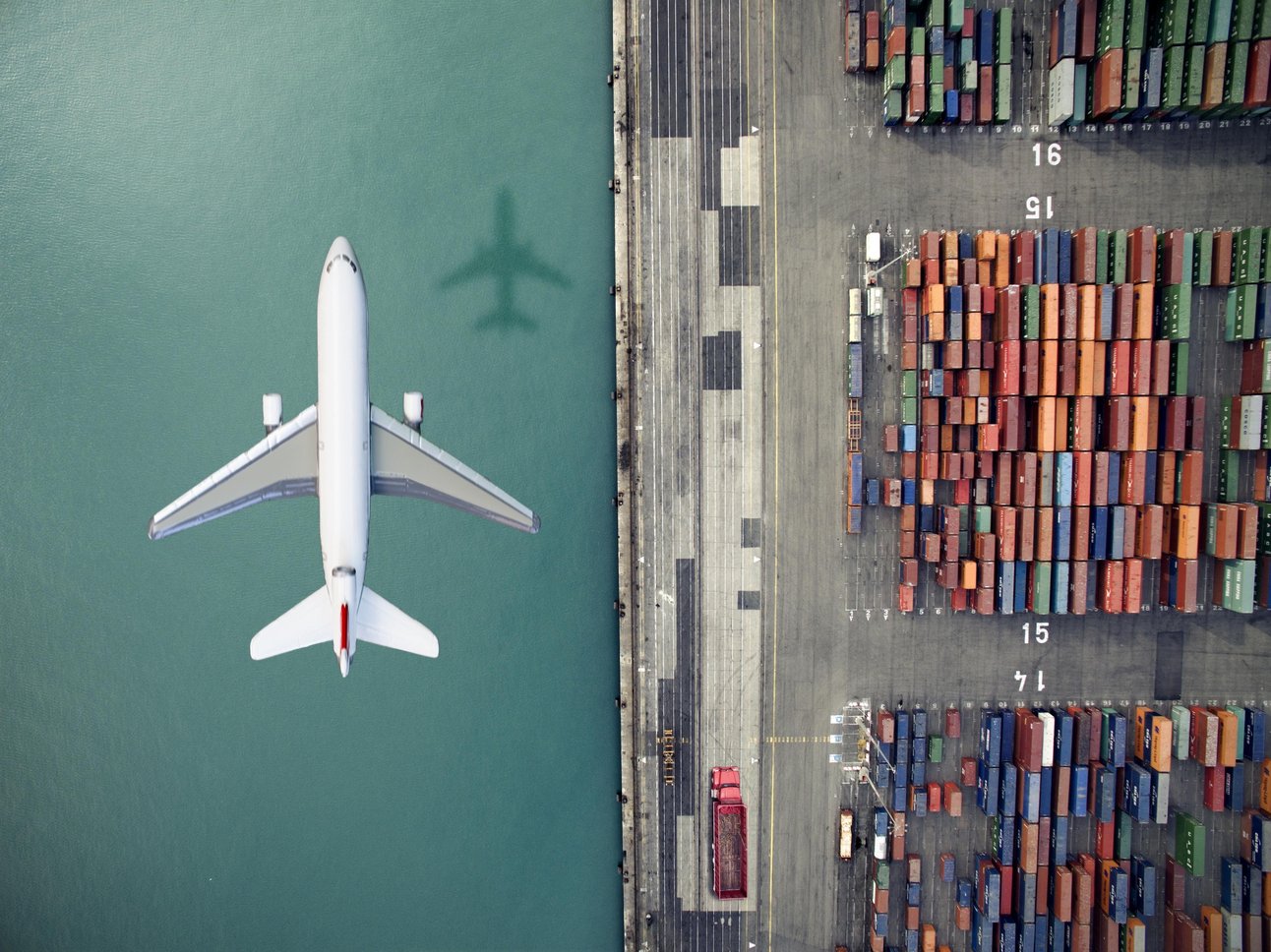 20221171558776_offsetting--plane-and-shipping-port.jpg